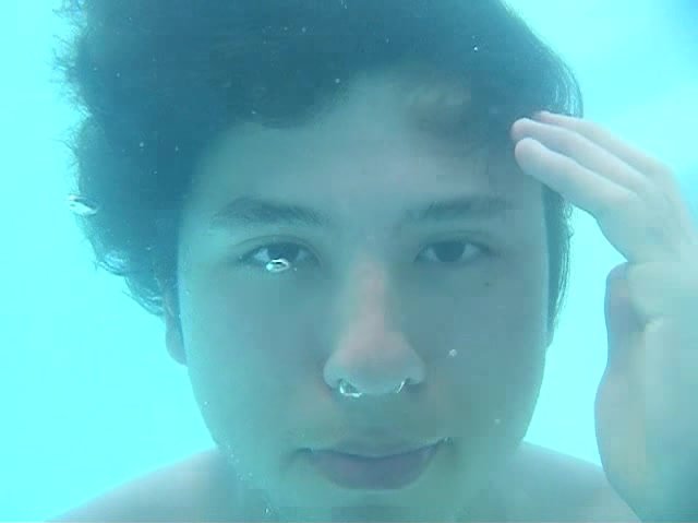 Barefaced underwater asian guy