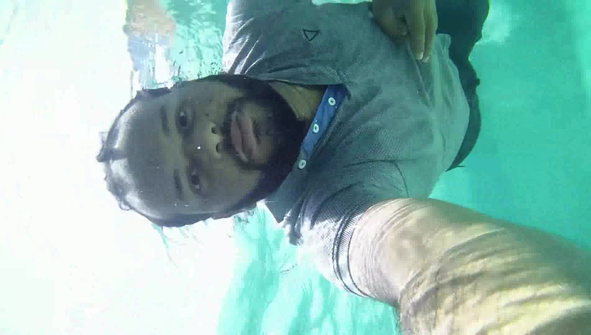 Underwater barefaced clothed arab