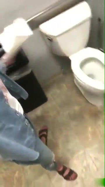 Girl pooping on public bathroom floor