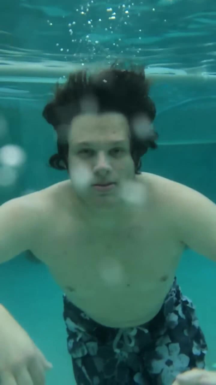 Tyler swimming underwater in slow motion