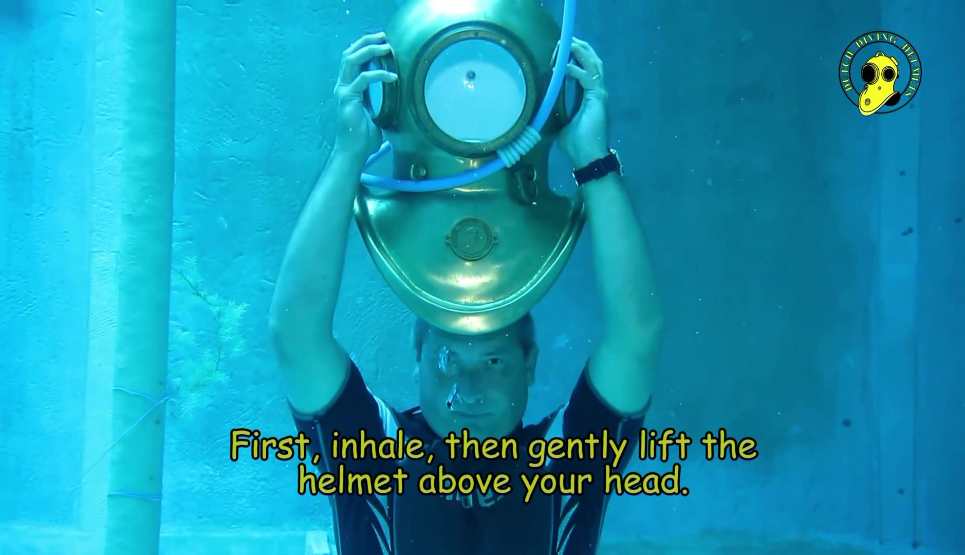 Frank showing helmet diving skills underwater