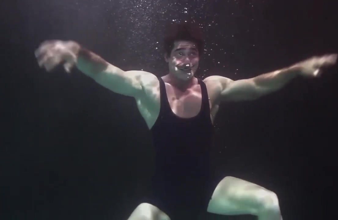 Muscled Robert barefaced underwater