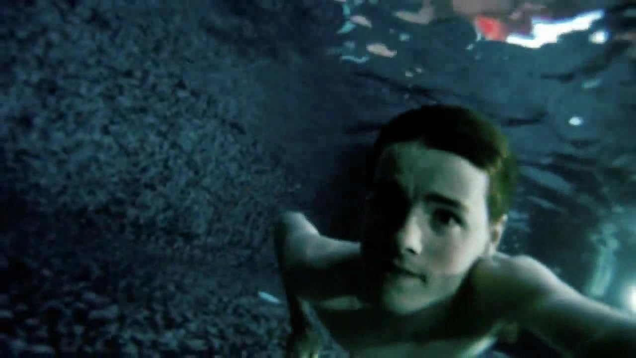 Swimming barefaced underwater in dark pool