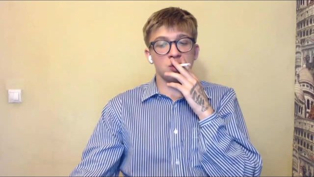 nerdy boy smokes a cig