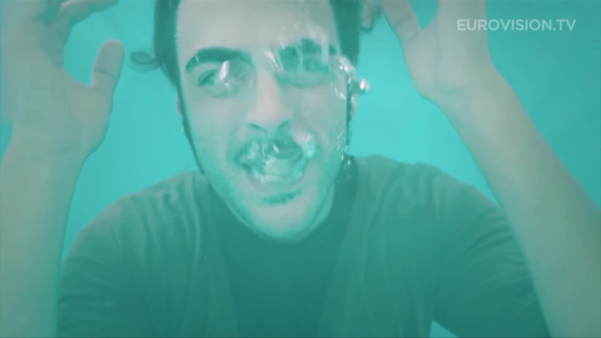 Clothed Marco barefaced underwater