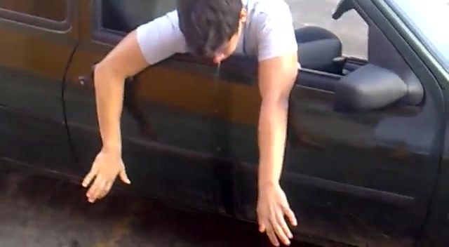 Drunk guy blows chunks out car window