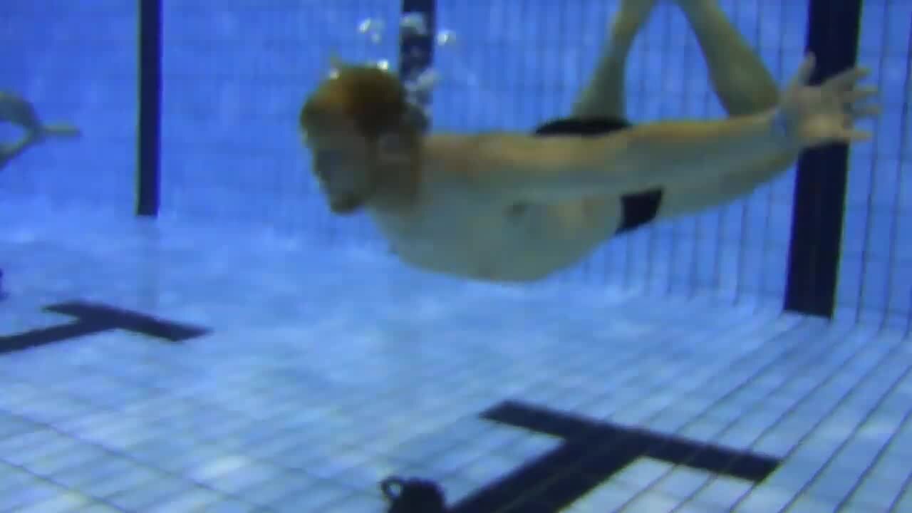 Redhead barefaced underwater