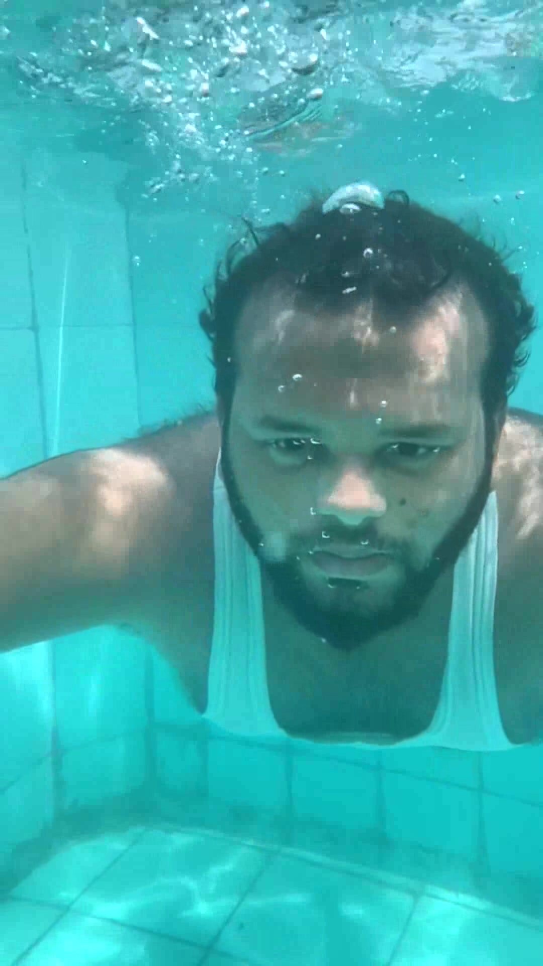 Underwater barefaced arab in tank top