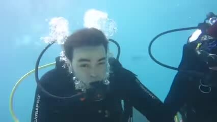 Underwater maskless scubadiver in sea