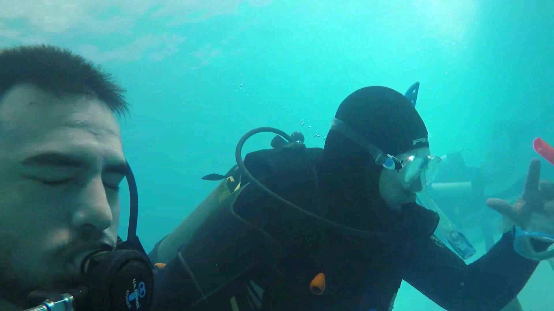 Cheeky scubadiver barefaced underwater