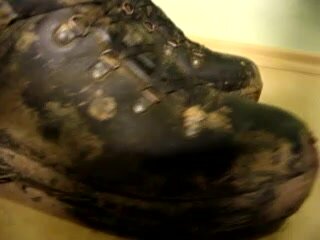 Muddy army boots.