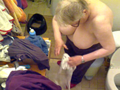 Fat granny gets dressed in hidden cam footage