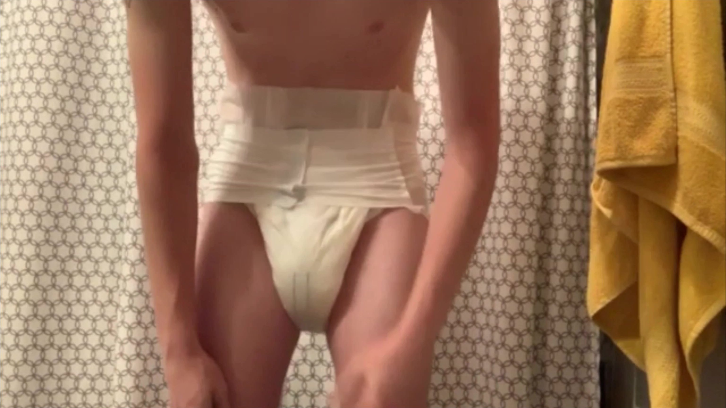 Twink gets dressed in wet diaper