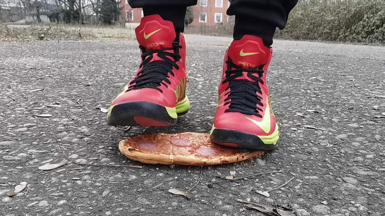 Stomping a Pizza with Nike Shoes