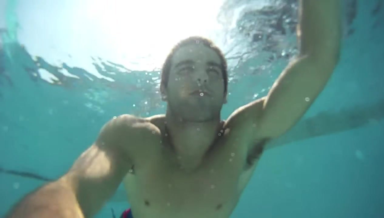 Underwater fit guy swimming