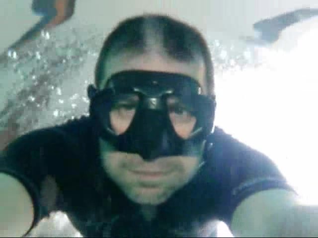 Underwater freedivers in wetsuits