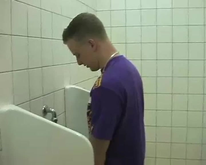 blond guy walks to toilet for a piss