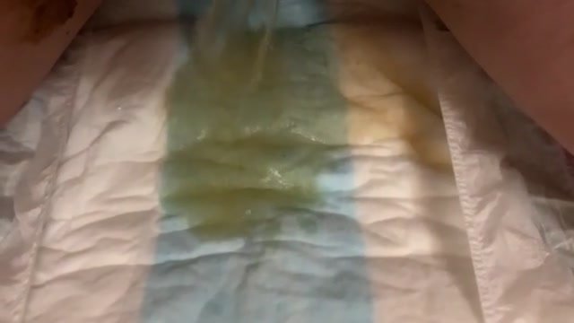 Girl pisses in open diaper