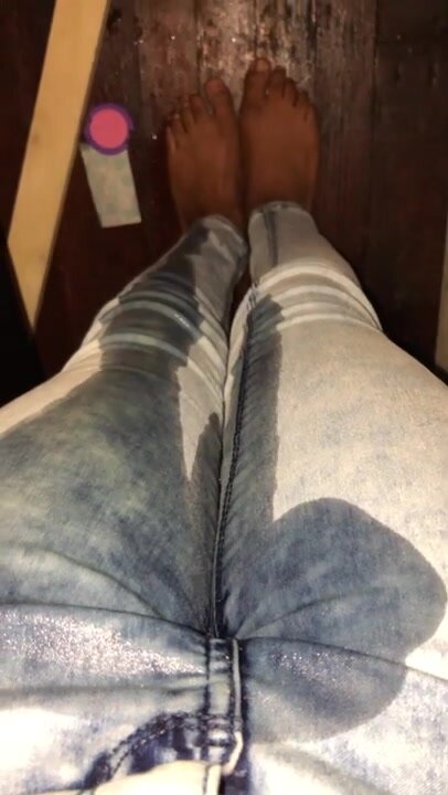 Ebony teen peeing her jeans