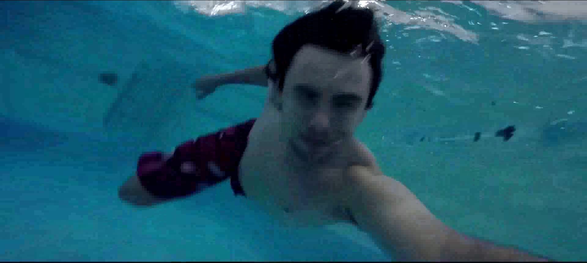 Long haired cutie underwater in pool