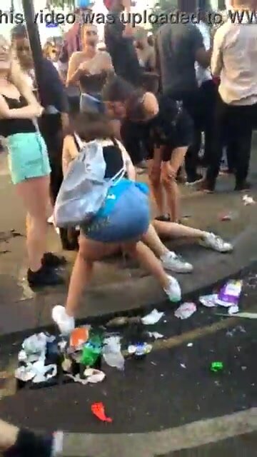Dirty girl pissing in broad daylight between people