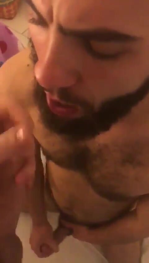 Bearded guy gets a load on his face