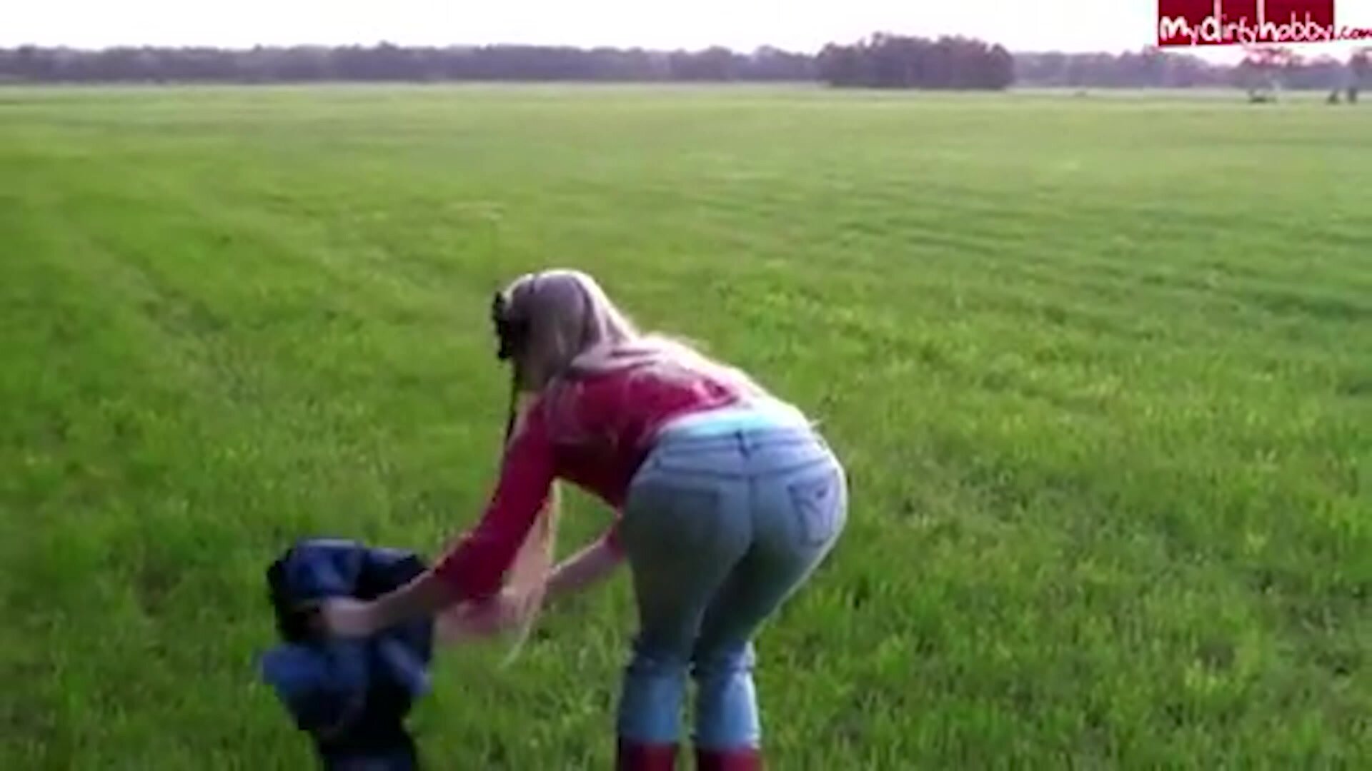 Jeans peeing on grass