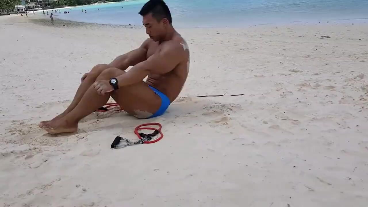 Korean bodybuilder work out in the beach