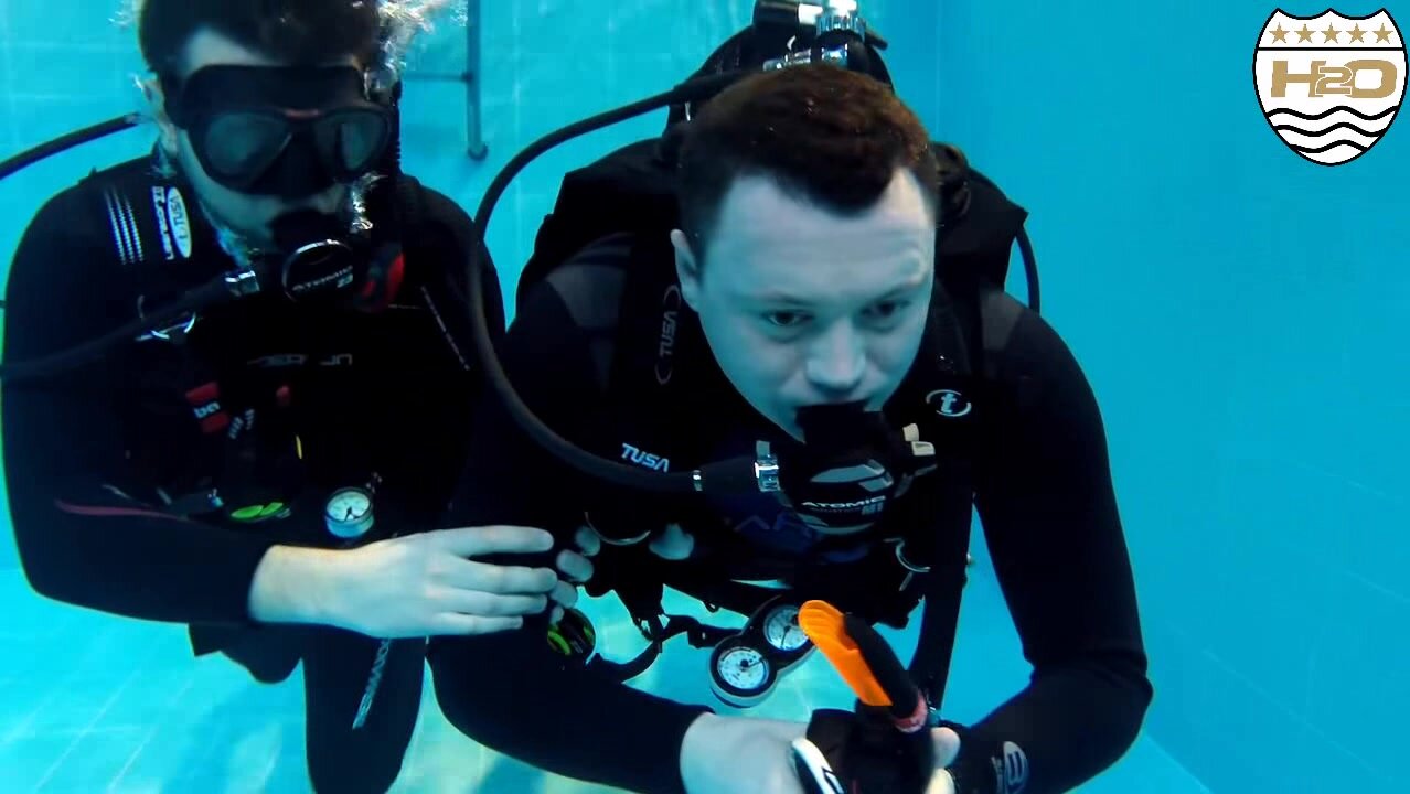Beefy scubadiver's underwater mask removal