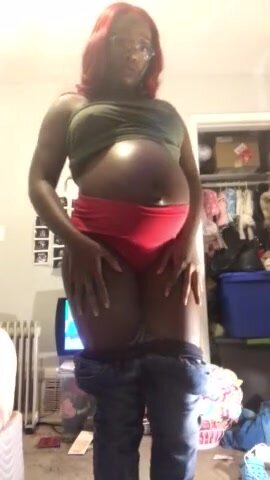 Ebony pregnant shows off belly