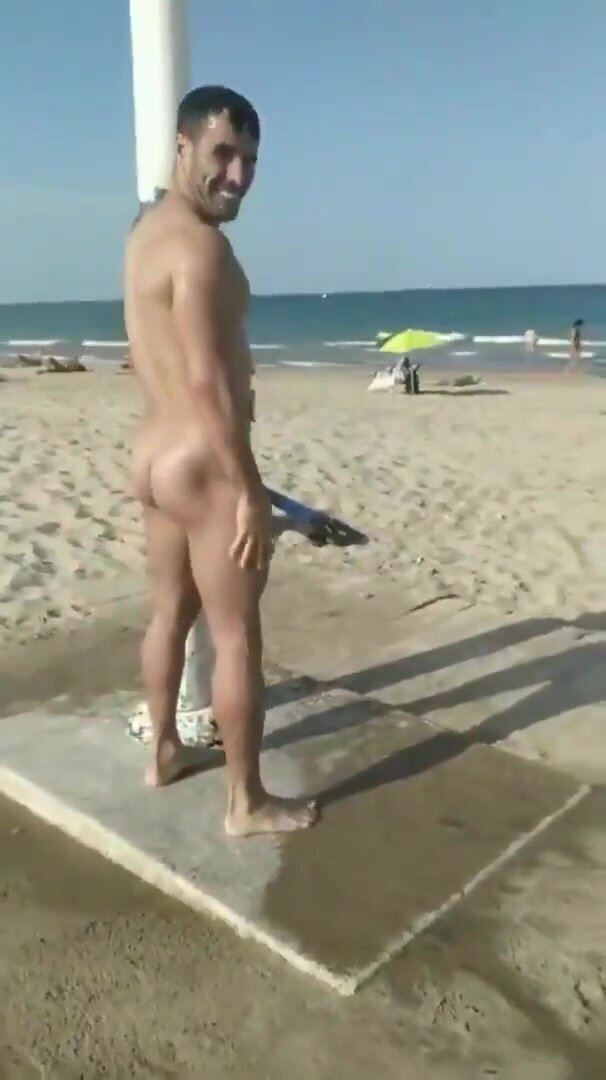 Showering off nude at the beach