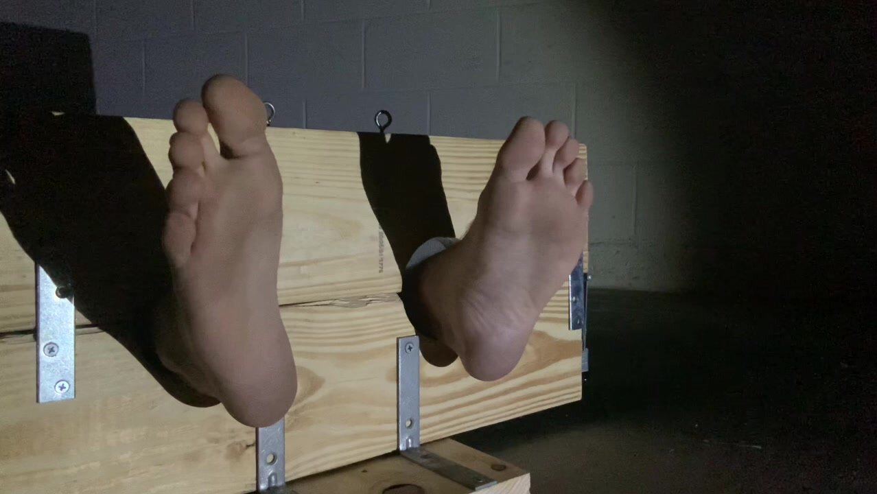 Inmate is barefoot in the Stocks