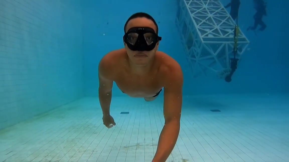 Brazilian hottie swimming underwater