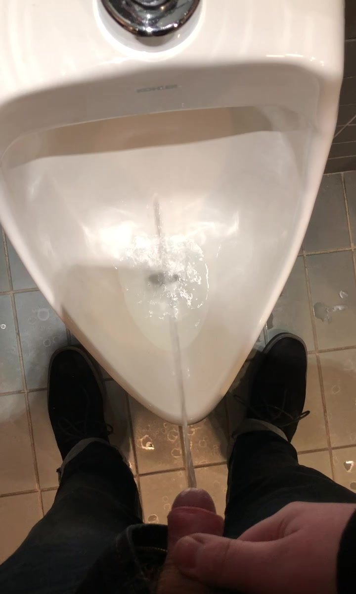 Thick uncut cock pissing in the urinal