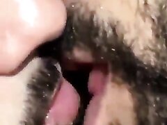 Bearded men tongue kissing