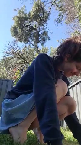 Cute girl peeing outside