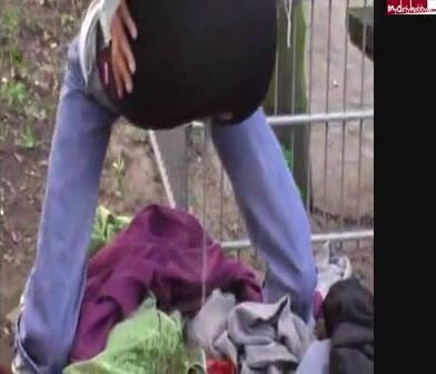 german chick pees on clothing outdoor