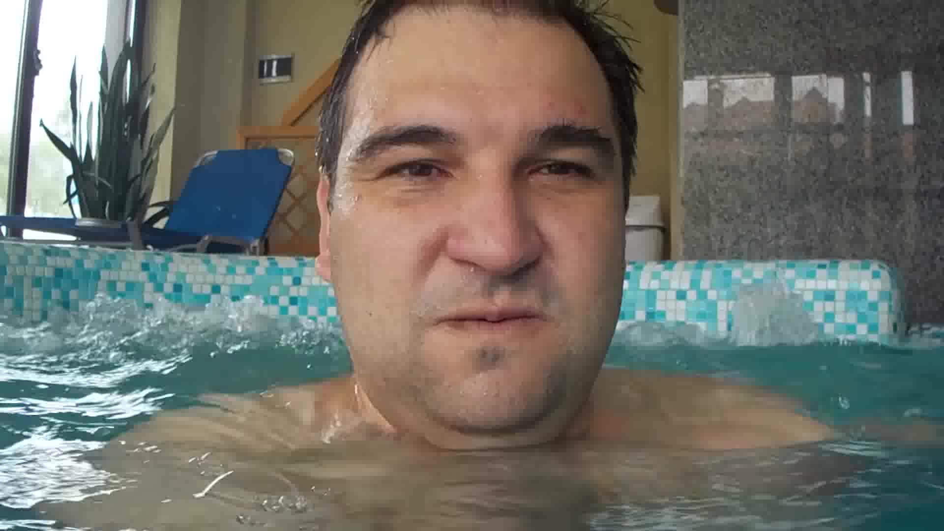 Beefy guy barefaced underwater in pool - video 2