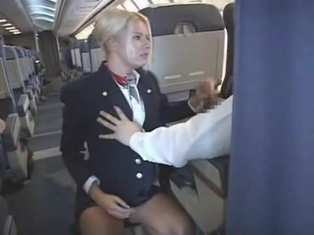 Blonde flight attendant blows a guy on the plane