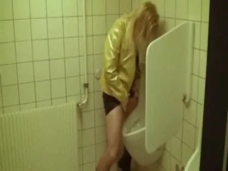 Drunk blonde pees in a urinal - voyeur porn at ThisVid tube