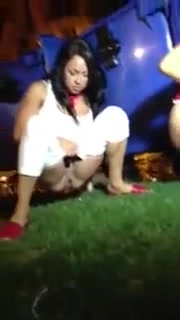 Party girls piss outdoors at night