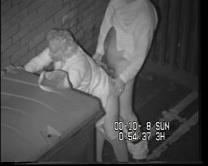 Mature couple fucks behind a dumpster on security camera