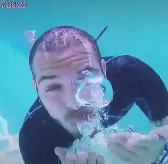 Barefaced underwater in wetsuit - video 2