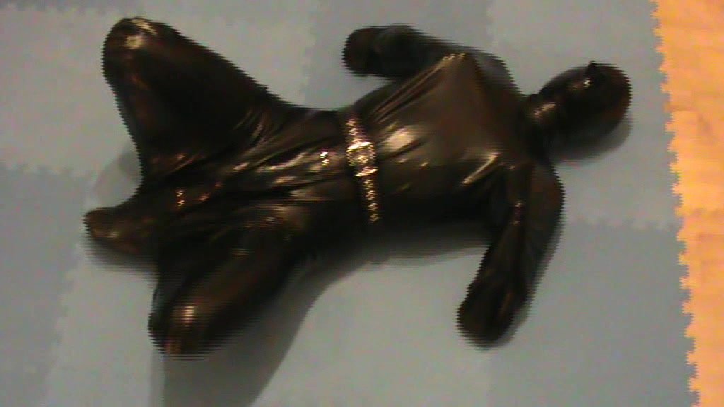 Slave as hogsacked rubber puppy