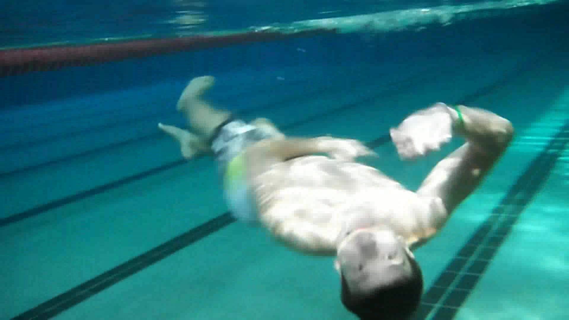 Underwater barefaced swimmers in pool