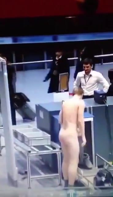 GUY STRIPS IN THE AIRPORT