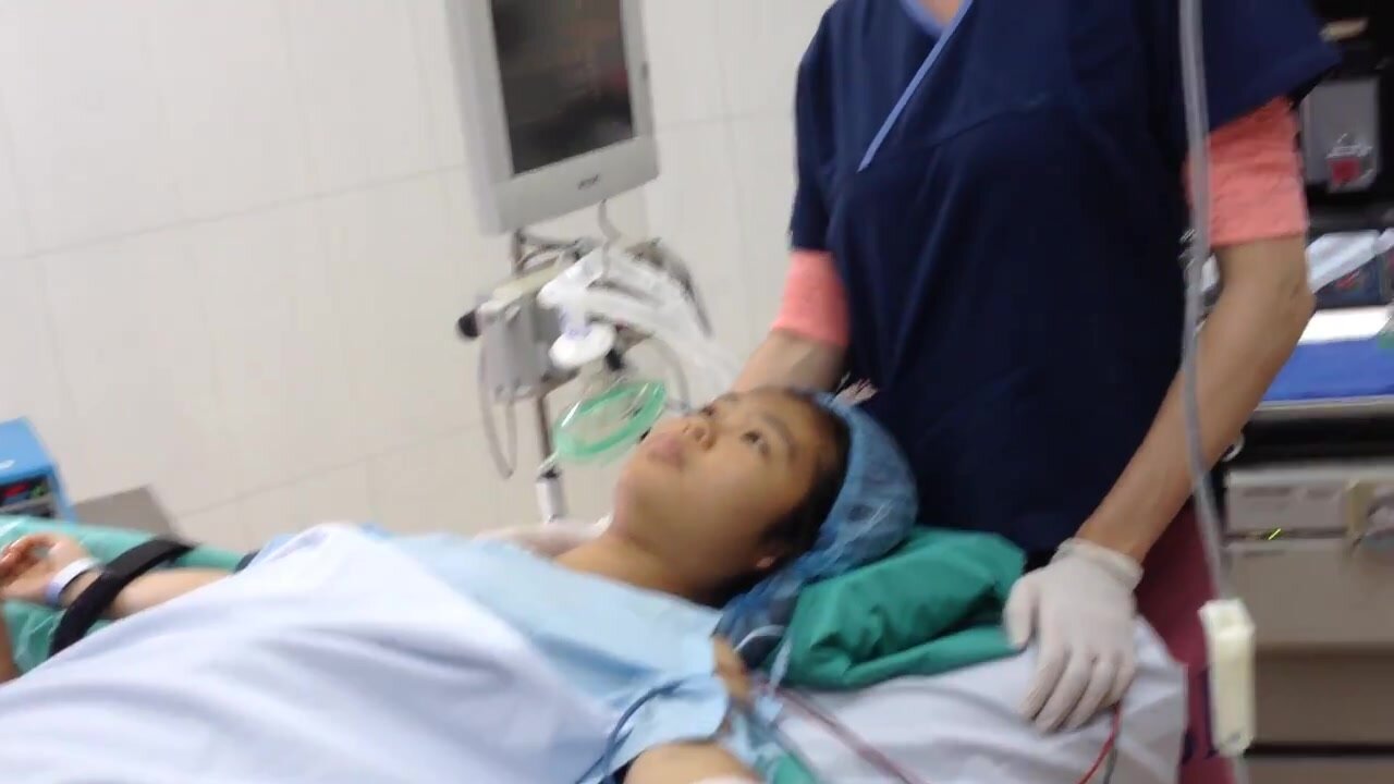 Asian girl under anesthesia mask