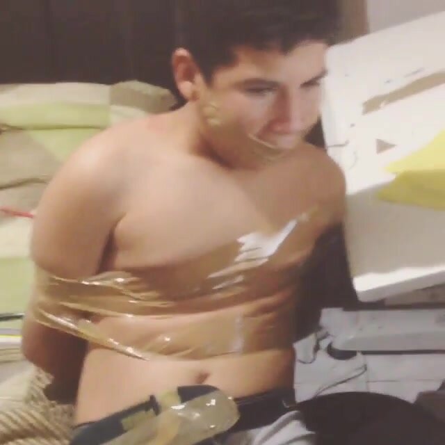 gagged guy taped to chair in underwear
