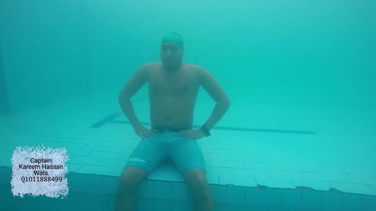 Kareem barefaced underwater with swimcap