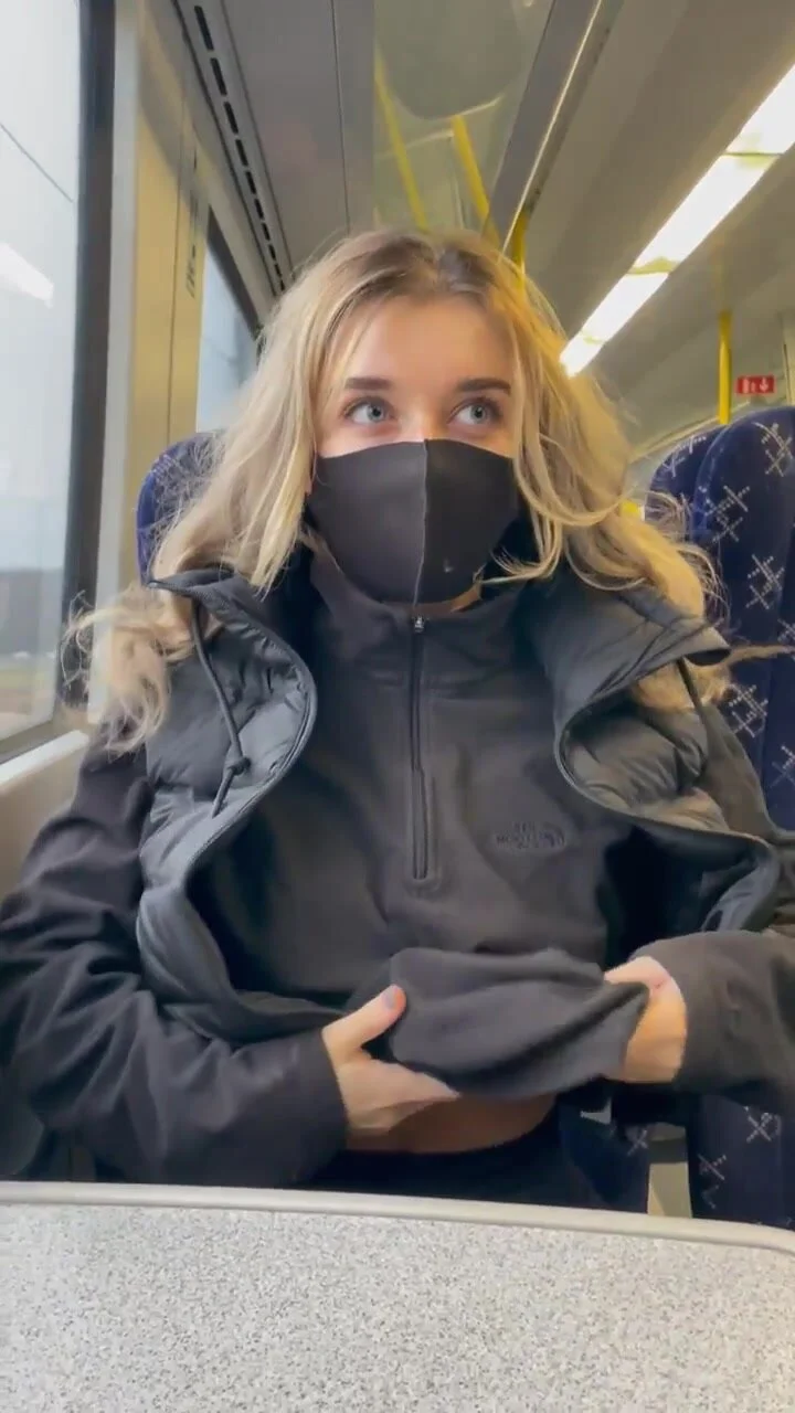 Flashing her tits on the train